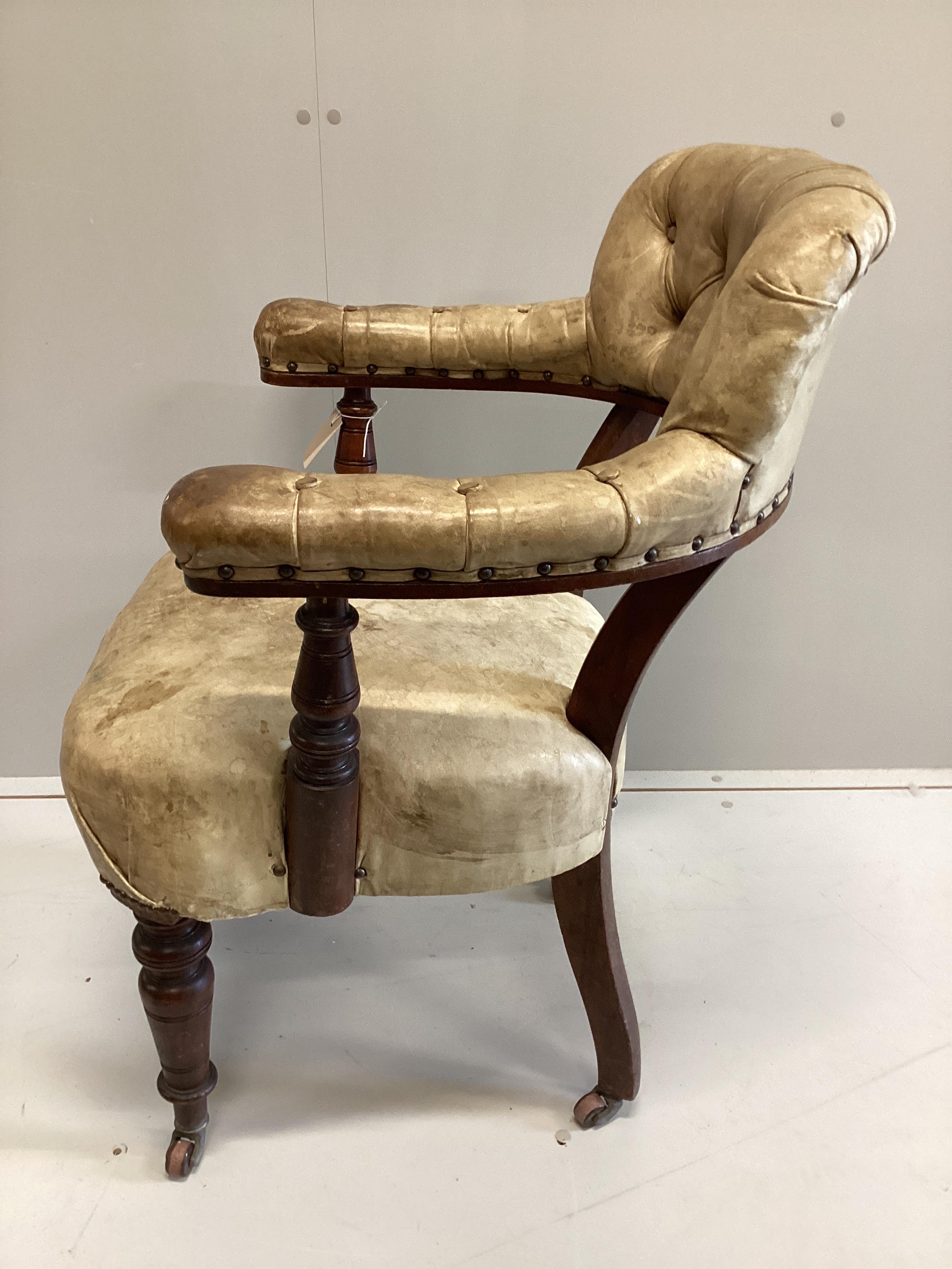 A late Victorian mahogany and buttoned leather tub frame desk chair, width 62cm, depth 50cm, height 90cm